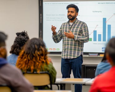 A faculty member for Georgia Southern's B.S. in Information Technology program describes data science applications to a classroom of students