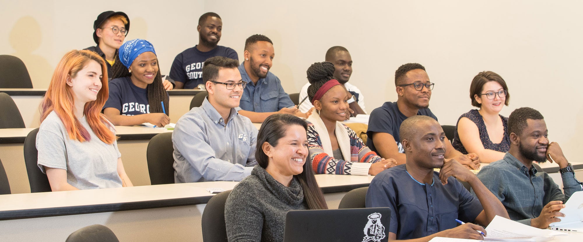 B.A. in World Languages and Cultures, Spanish Concentrations students listen and smile in a lecture-style class at Georgia Southern