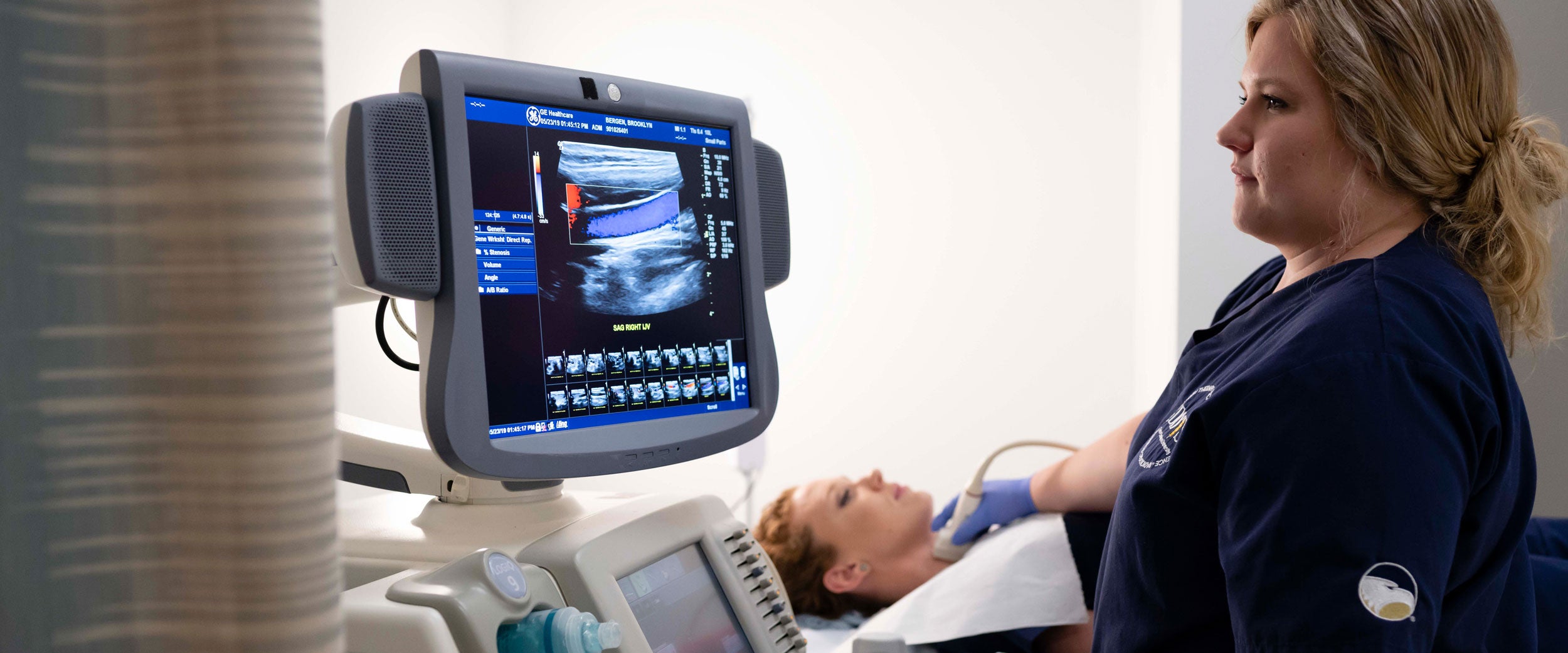 A B.S. in Radiologic Sciences, Diagnostic Medical Sonography student at Georgia Southern practices using imaging equipment in a simulation space.