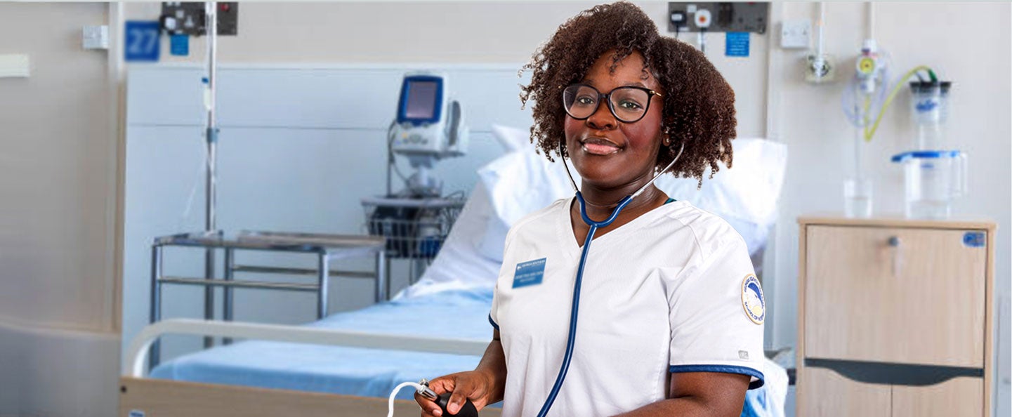 A Georgia Southern BSN student wears a stethoscope in an on-campus clinical space