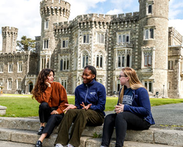 Three BSN students sit down for a conversation in front of Georgia Southern's Wexford, Ireland campus.