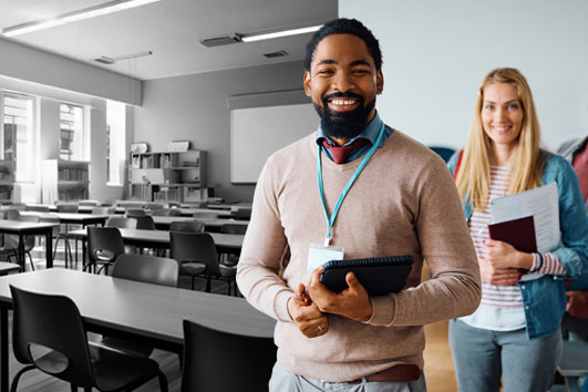 Students from Georgia Southern's College of Education smile as they walk into a classroom