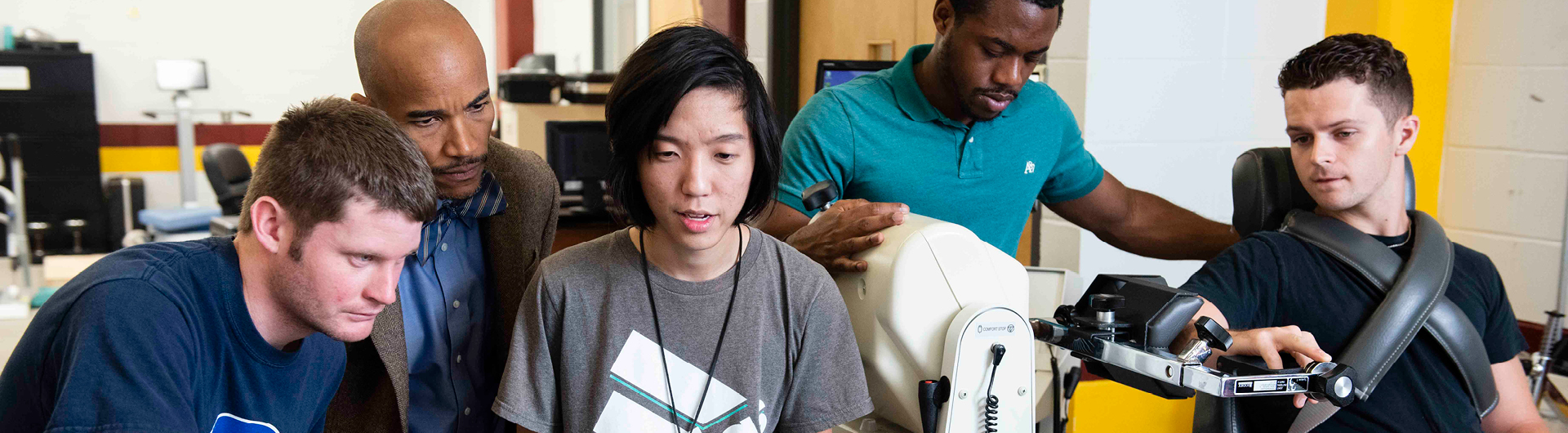 A group of students from Georgia Southern's M.S. in Kinesiology, Sport and Exercise Psychology program conduct research using athletic training equipment