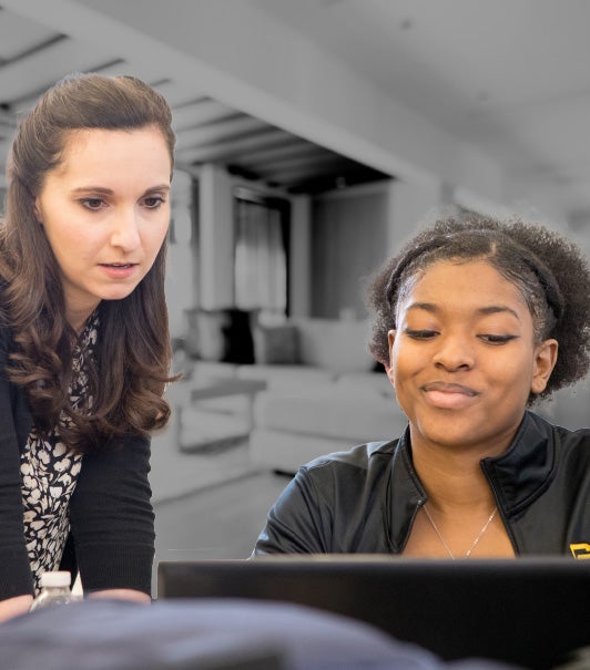 A faculty member and student from Georgia Southern's Jiann-Ping Hsu College of Public Health review information on a computer screen