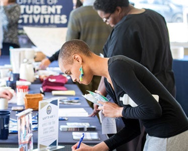 Students from Georgia Southern's Accelerated BSN program browse student clubs and organizations at an activities fair