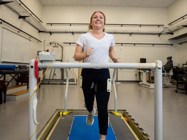 A student from Georgia Southern's B.S. in Kinesiology, Exercise Science program runs on a treadmill in one of the Human Performance and Body Composition Laboratories.