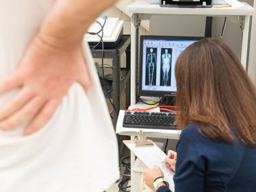 A B.S. in Kinesiology, Exercise Science student from Georgia Southern assesses the physiology and composition of the human body from a computer screen.