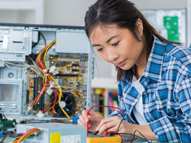 A student in Georgia Southern's Department of Computer Science examines computer hardware components