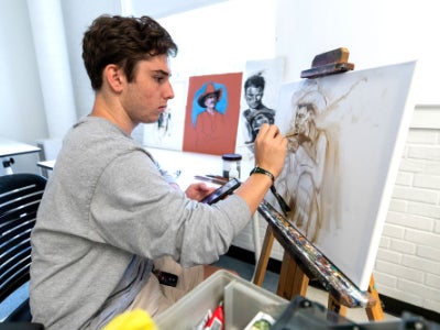 georgia southern art student, artist drawing portrait