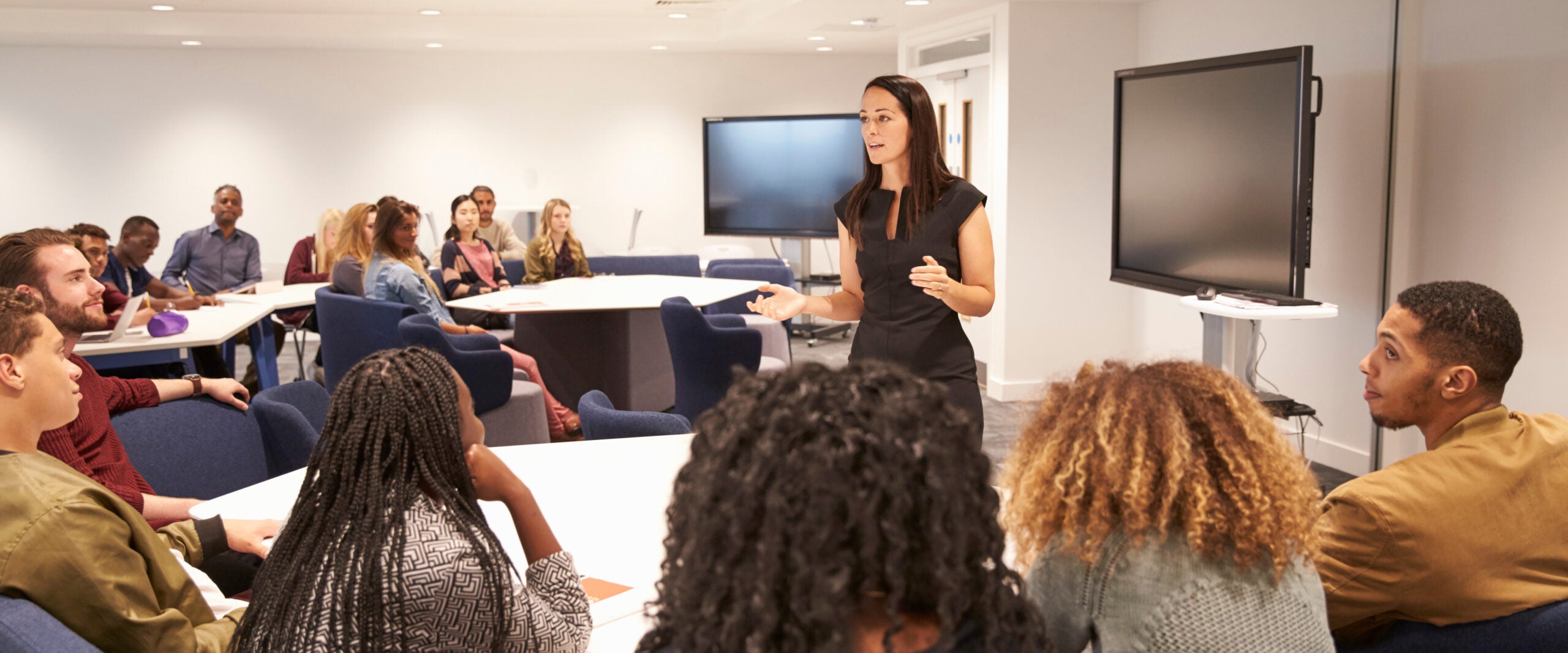 georgia southern student speaking in classroom setting, presenting a concept with media