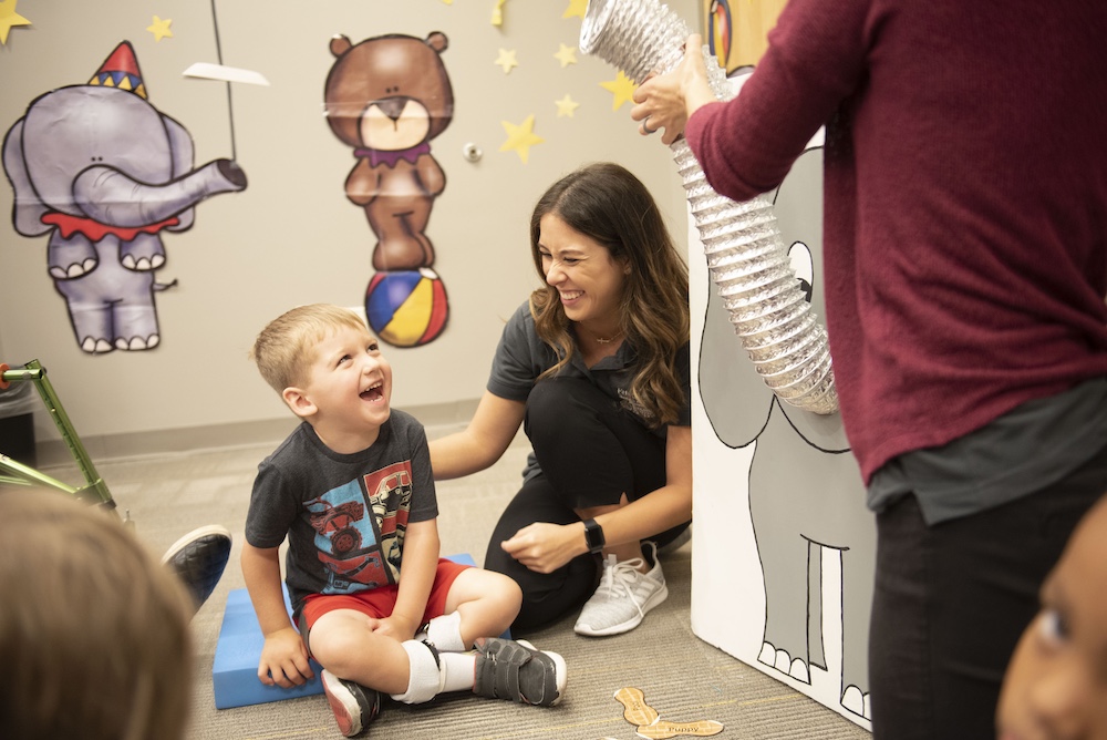 A worker celebrates a child.