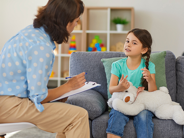 A student from Georgia Southern's master's in psychology program interviews a child subject for their research project