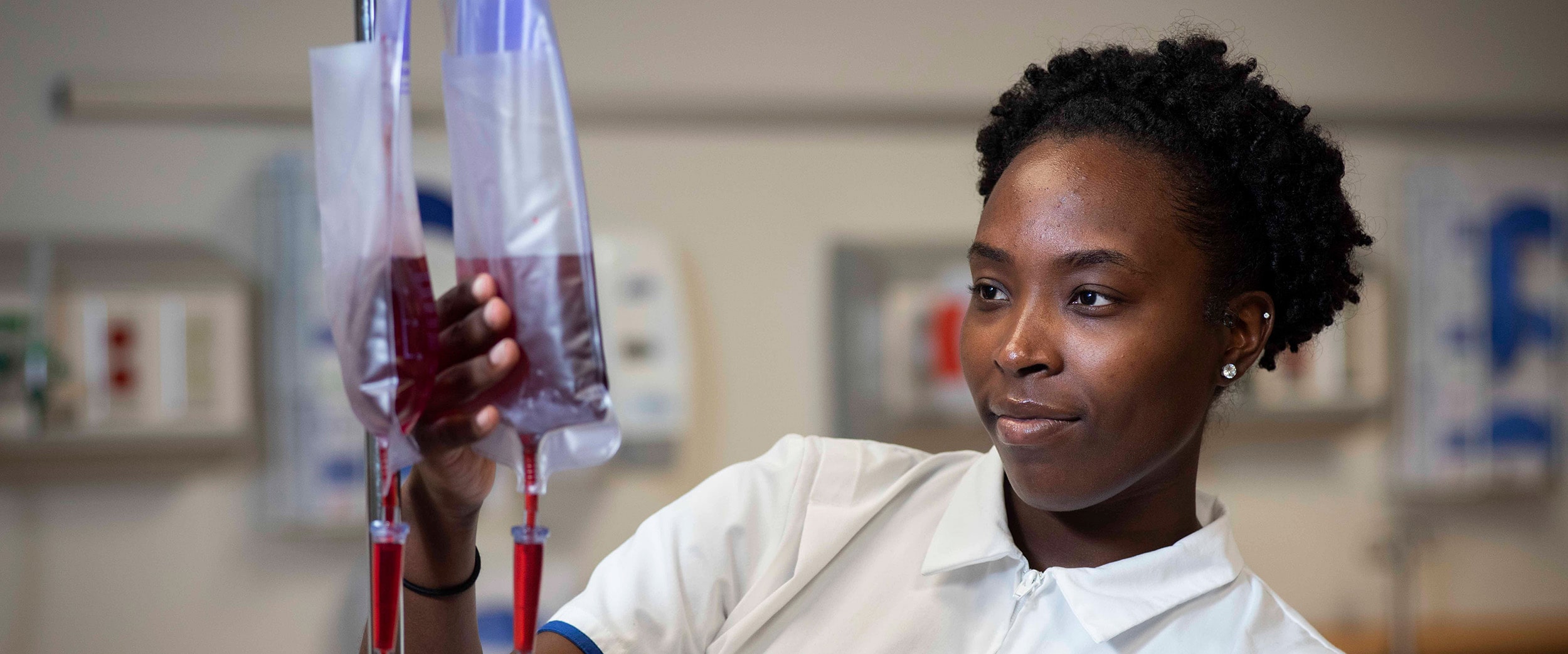 A student from Georgia Southern's DNP program assesses a bag of blood