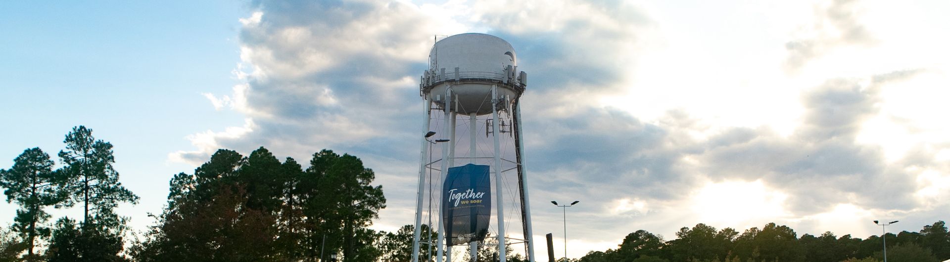 Water tower displaying the Together We Soar banner