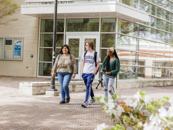 Three students walking on Georgia Southern Campus