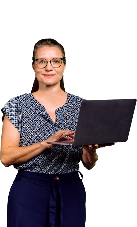 A standing woman holding a laptop computer