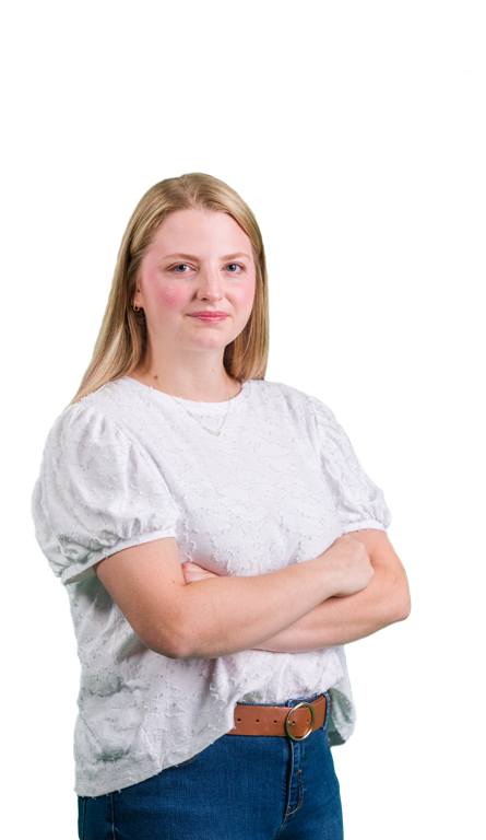 A female Georgia Southern undergraduate student standing with her arms across her body.