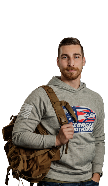 A male Georgia Southern student with a camouflage backpack over his shoulder