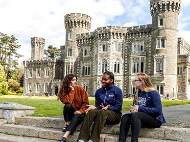 Three students from Georgia Southern's B.S. in Geosciences program converse outside the European campus in Wexford, Ireland