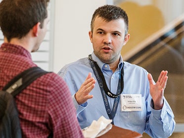 A staff member talking to a student