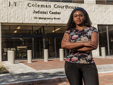 A student from Georgia Southern's M.S. in Criminal Justice and Criminology program examines audio samples with a mentor during an internship