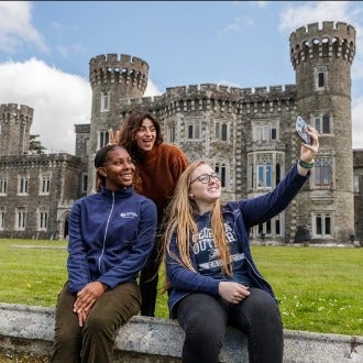 Georgia Southern study abroad students gather for a group selfie in front of a castle near Wexford, Ireland.