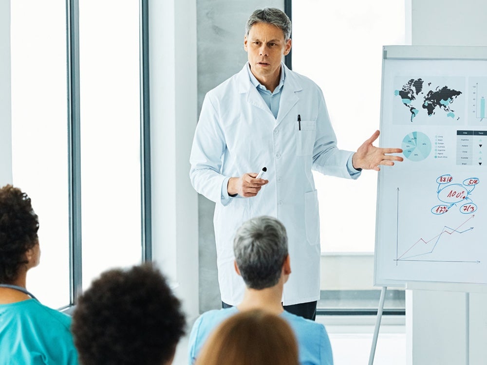 Georgia Southern faculty member presenting to a group of Georgia Southern EagleMed students.