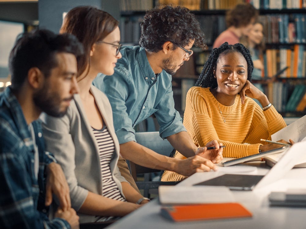 Group of Georgia Southern students together in the library.