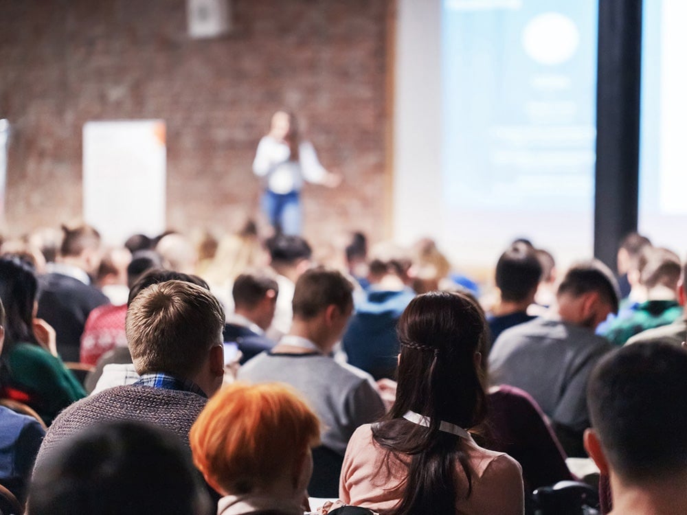 Students from Georgia Southern's M.Ed. in School Counseling program listen to a speaker during a conference