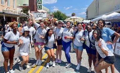 Honors Savannah Scholars enjoy some of Leopold's famous ice cream at a street fair on Broughton Street.