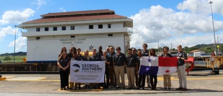 A study abroad group from Parker College of Business visits the locks of the Panama Canal.